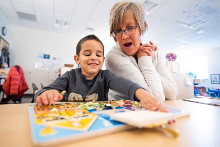 Grand View Elementary preschooler and Joan Scheuerman learning together