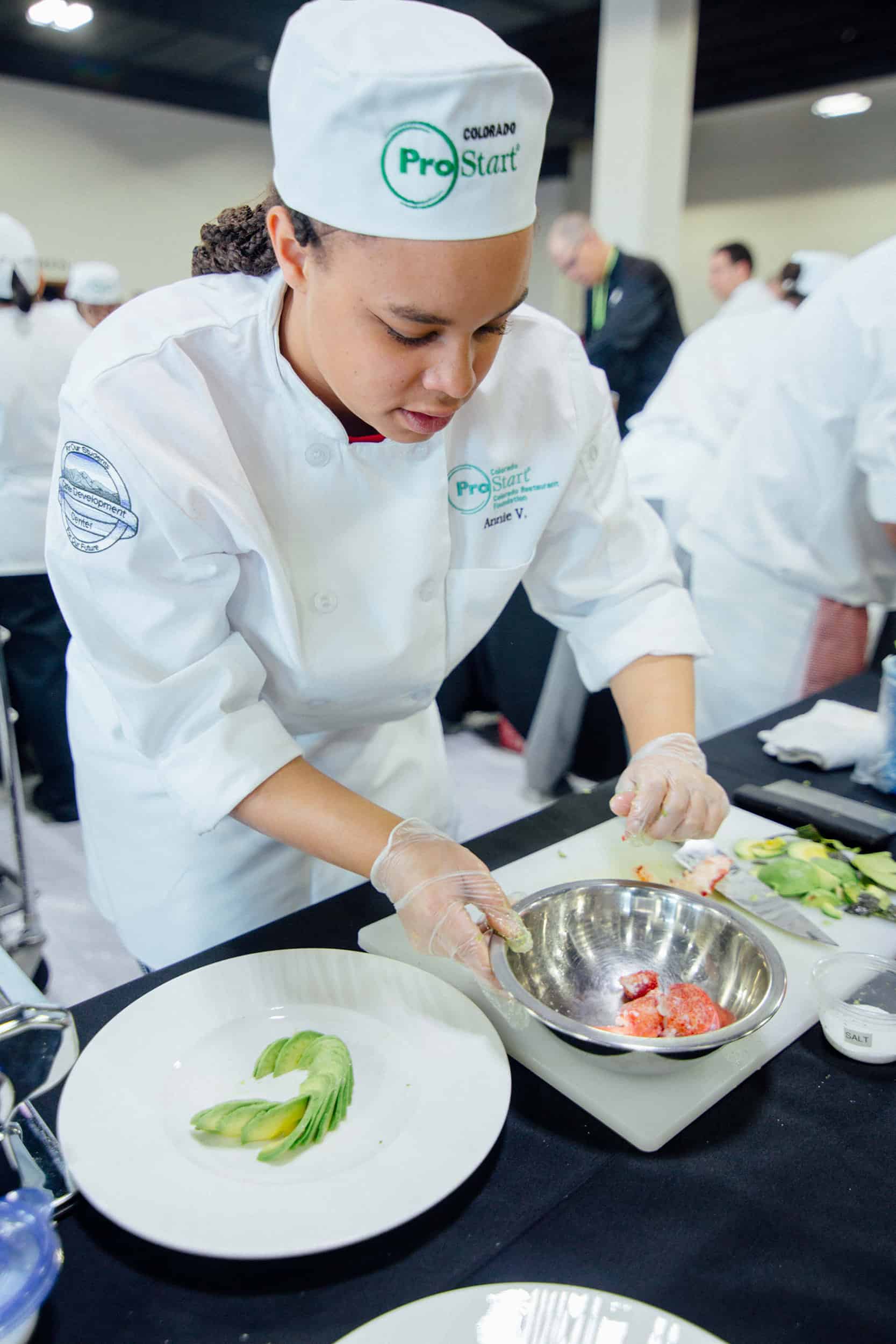 CDC culinary student prepares an avocado salad
