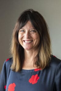 Smiling woman with brown hair and blue eyes