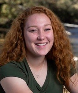 Silver Creek graduate in a green shirt.