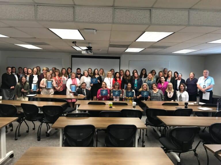 A large group of Student Services staff members with Superintendent Don Haddad