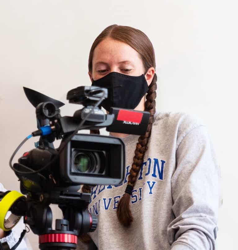 Two students with a video camera