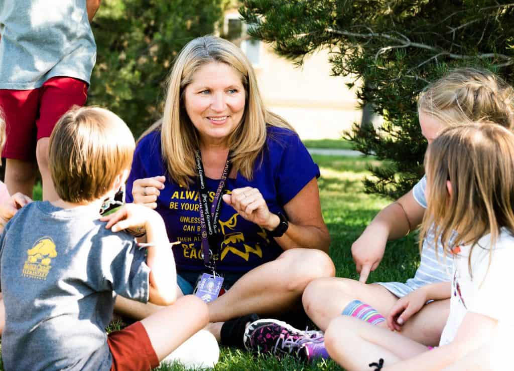 Melodie Erdmann working outside with Community Schools children