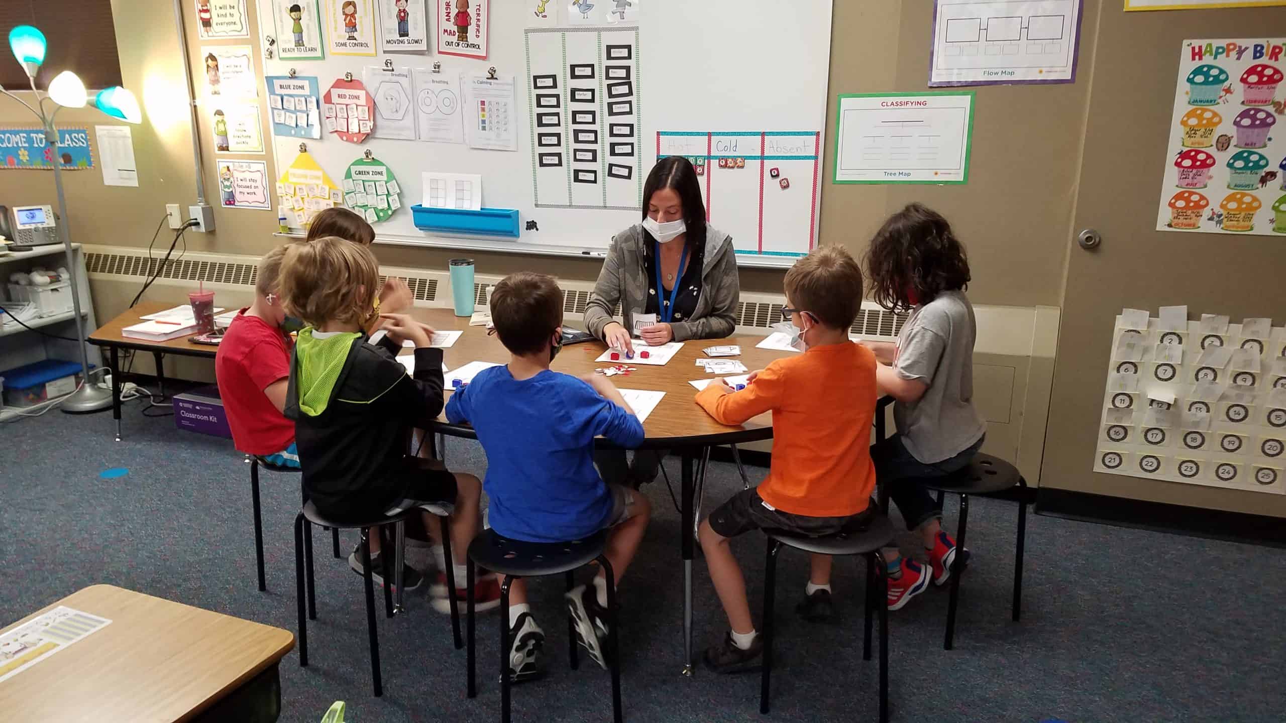 Teacher working with students during Dragon Time