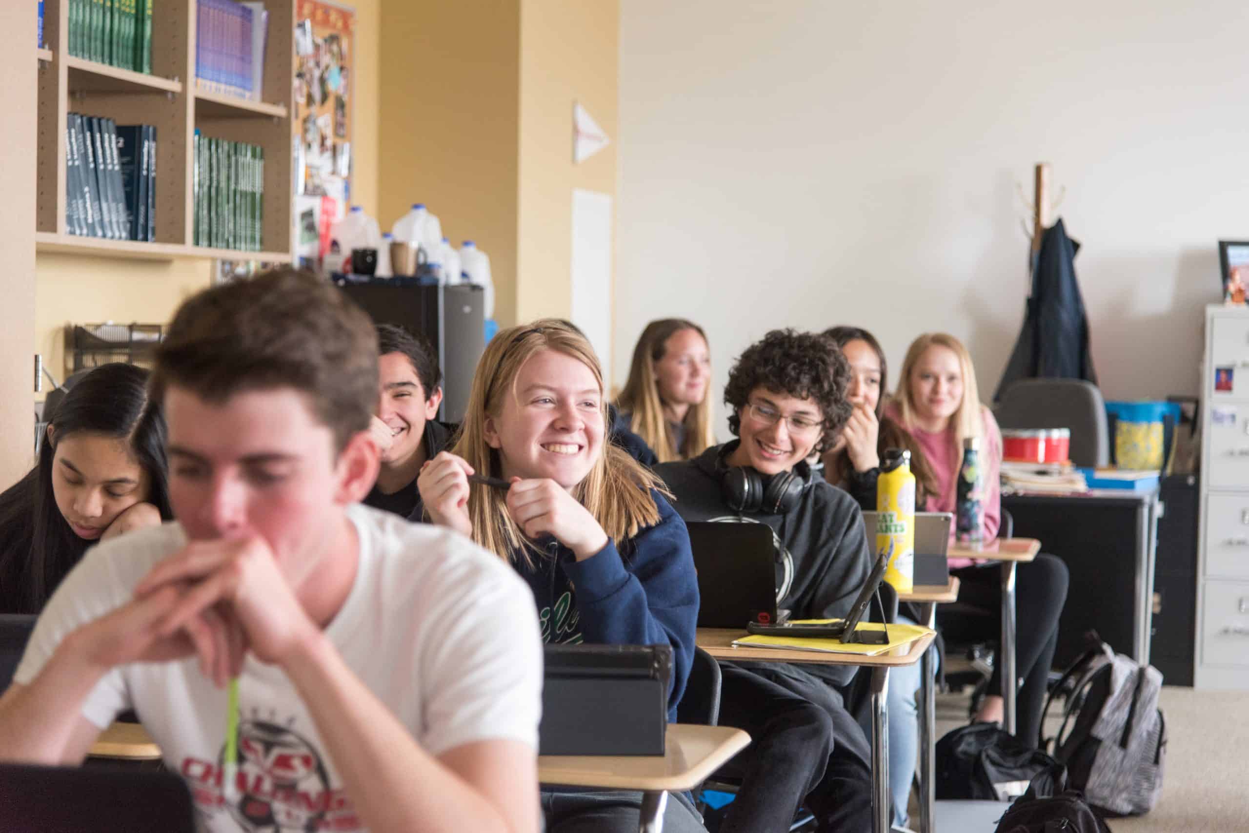 Group of students in classroom smiling