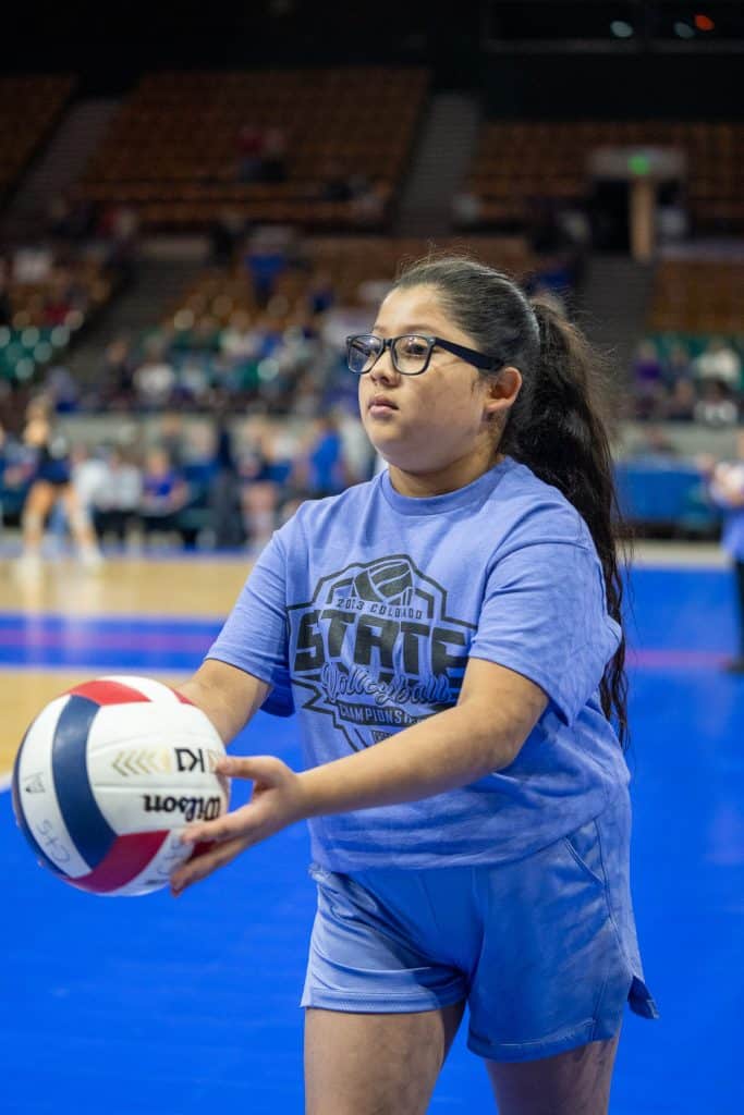 A St. Vrain student shags a ball and returns it to player ready to serve.