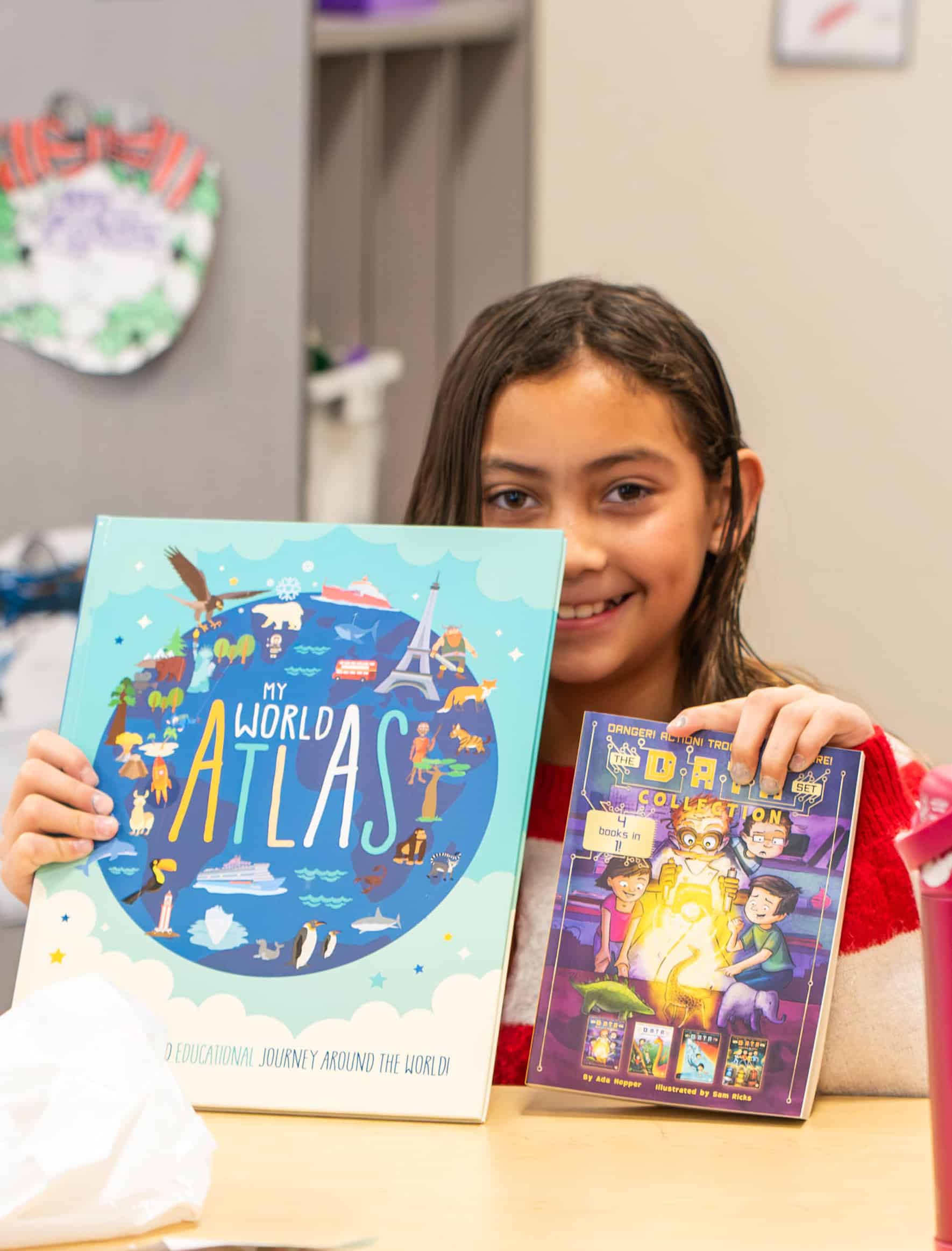 Grand View Elementary 3rd grade student shows new books