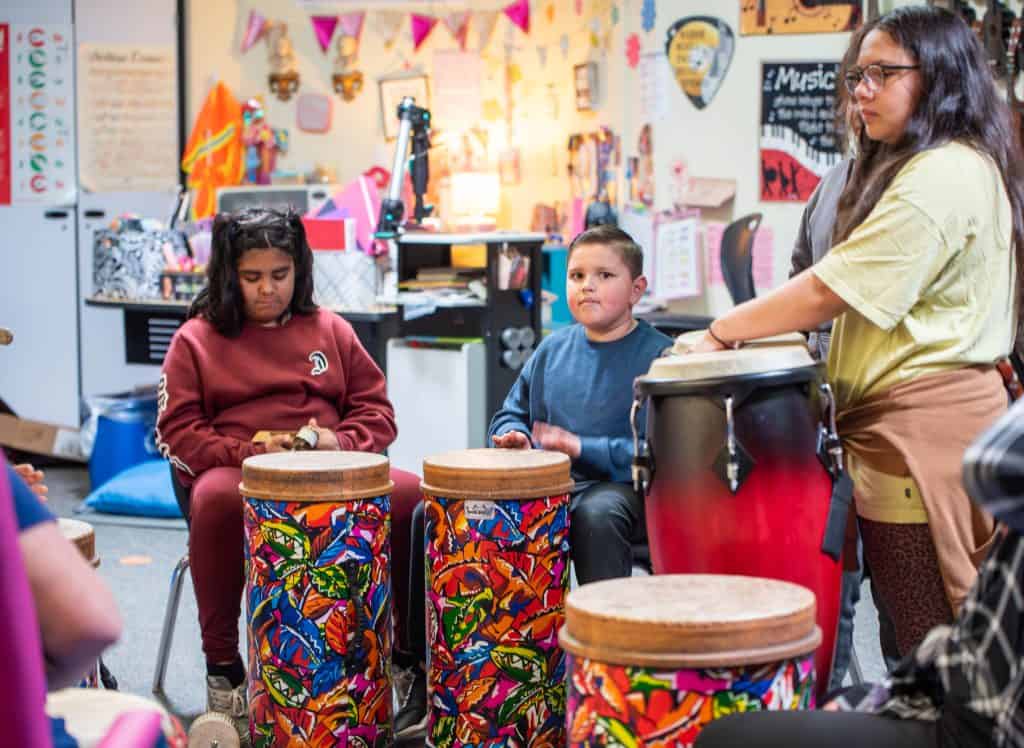 students play drums during SEL day at Rocky Mountain