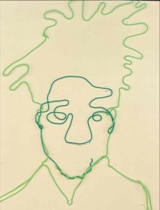 Line art portrait of a person with messy hair, created using green and blue wire against a light background.