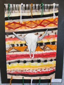 A colorful artwork featuring a bull skull against horizontal stripes of vibrant colors and patterns.