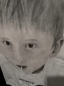 Close-up drawing of a child sipping from a juice box labeled "Honest Kids," with a focus on their expressive eyes.