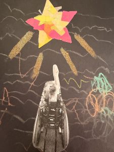 A child in a wheelchair reaches towards a colorful star on a dark background, surrounded by vibrant chalk drawings.