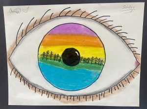 A colorful drawing of an eye with a sunset landscape reflected in the iris, featuring trees and gradient colors.