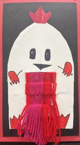 A playful chicken drawing with a red crown, holding a scarf made of pink and red yarn against a black background.