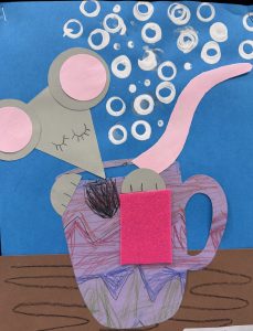 A playful mouse with large ears peeks out of a colorful mug, surrounded by white bubbles on a blue background.