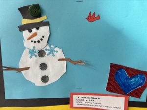 A colorful snowman with a top hat and arms made of branches, set against a blue background with a red bird and heart.
