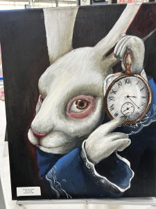 A white rabbit in a blue coat holds a pocket watch, looking intently at it with large, expressive eyes.