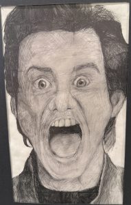 A detailed pencil drawing of a person with wide eyes and an open mouth, expressing shock or fear.