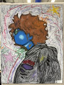 A colorful chalk drawing of a person with curly hair and a blue face, surrounded by stars and scribbles.