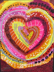 Colorful abstract heart design featuring concentric patterns in pink, orange, yellow, and black.