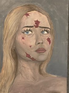 A portrait of a woman with long blonde hair and blue eyes, featuring cracks and red markings on her face.