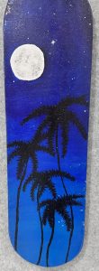 A night sky with a full moon and stars, featuring silhouetted palm trees against a gradient of blue.