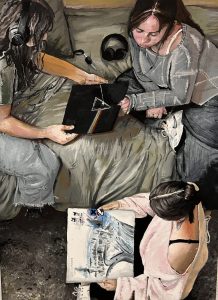 Three young women are seated on a couch, sharing a record and sketchbook, with headphones nearby.