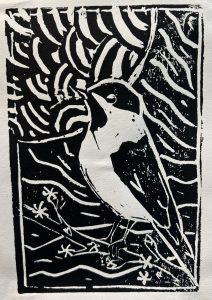 A black and white linocut print of a bird perched on a branch, surrounded by abstract patterns.