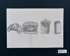 A pencil drawing of a croissant, hamburger, fries in a container, and a soda can on white paper.