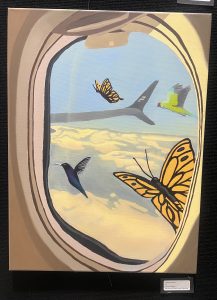 A colorful painting shows butterflies and a hummingbird outside an airplane window, with clouds in the background.