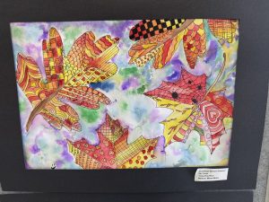 Colorful watercolor artwork featuring intricately patterned autumn leaves against a vibrant, abstract background.