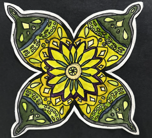 Colorful mandala design with yellow and green patterns on a black background, featuring a central flower motif.