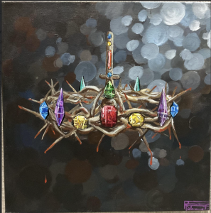 A crown made of thorns adorned with colorful jewels, set against a dark, blurred background.