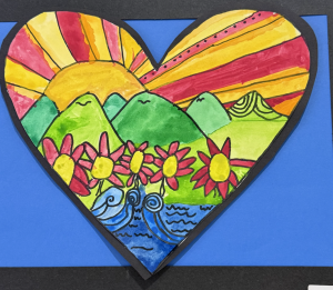 A colorful heart-shaped painting featuring mountains, a sun, flowers, and wavy water on a blue background.