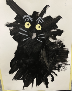 A black cat illustration with large yellow eyes and whiskers, created with bold brush strokes on paper.