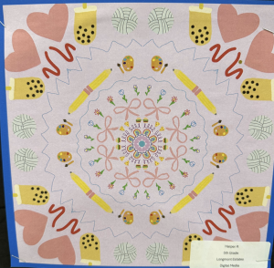 Colorful circular design featuring hearts, paint palettes, and bows, created by a 5th-grade student.