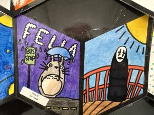 Illustration features a cartoon character with an umbrella at a bus stop and a mysterious figure in a black cloak.