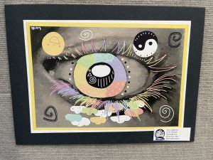 A colorful artistic depiction of a large eye surrounded by abstract shapes and patterns on a black background.