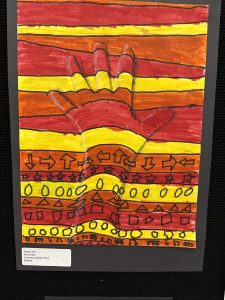 Colorful artwork featuring a handprint surrounded by bold, wavy lines and various shapes in red, orange, and yellow.