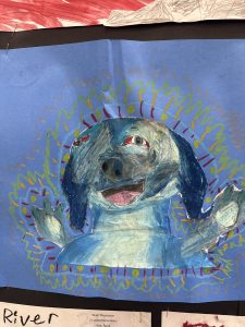 A colorful drawing of a happy blue dog with red eyes, surrounded by vibrant, swirling patterns on a blue background.