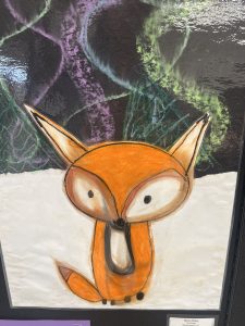 A colorful drawing of a fox with large eyes, set against a dark, abstract background.