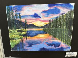 A colorful landscape featuring a sunset over a reflective lake, surrounded by trees and mountains.